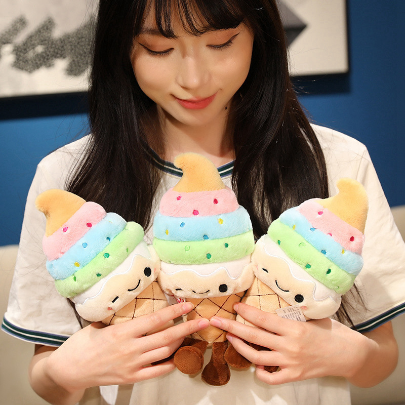 Rainbow Ice Cream Plush Toy with colorful soft serve layers, embroidered winking face, and dangling legs, showcasing its cute and collectible design