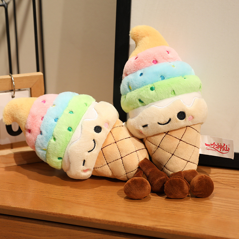 Rainbow Ice Cream Plush Toy featuring soft plush fabric, cheerful embroidered details, and playful dangling legs in a cozy indoor setting