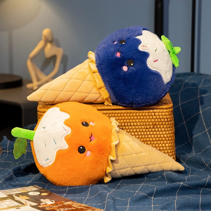Fruit Ice Cream Plush Toys in blueberry and orange designs displayed on a bed, featuring soft plush fabric, cheerful faces, and cozy decorative appeal