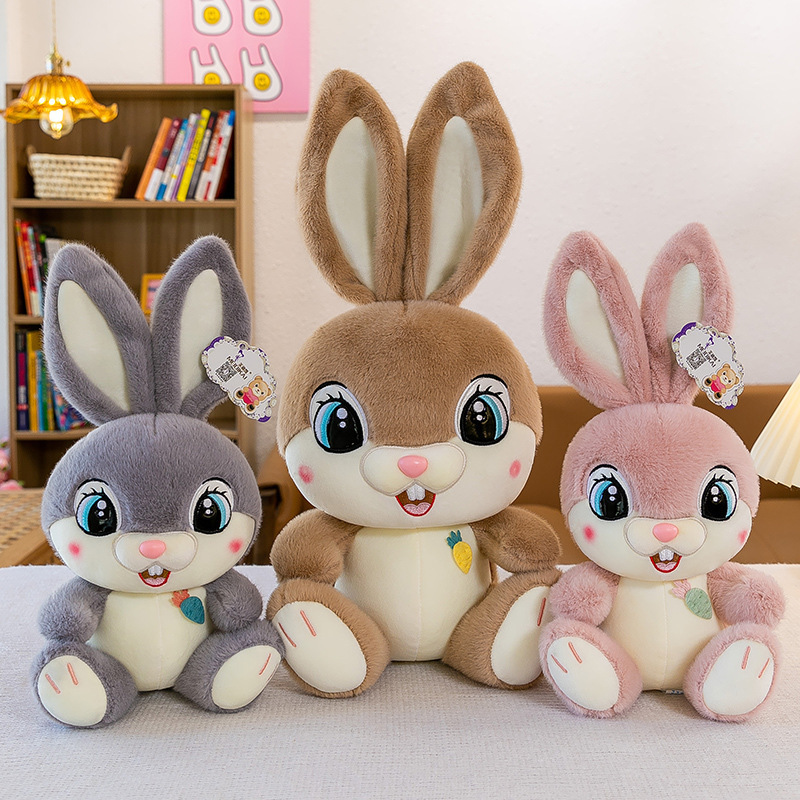 Sweet Bunny plush toys in Gray, Brown, and Pink, showcasing available color options with soft plush fabric, long ears, and a cozy decorative charm