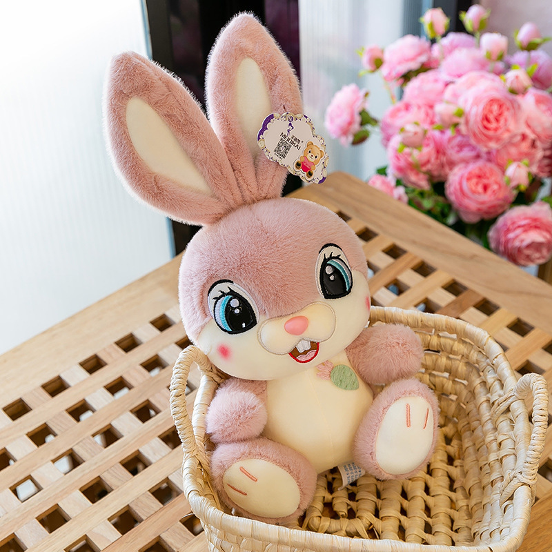 Pink Sweet Bunny plush toy sitting in a woven basket beside soft pink flowers, creating a cozy and charming decor scene for bedrooms, nurseries, and gift displays