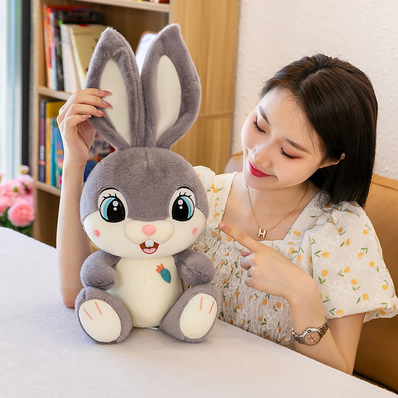 Gray Sweet Bunny plush toy highlighting its long floppy ears, soft texture, embroidered facial details, and cute carrot patch accent