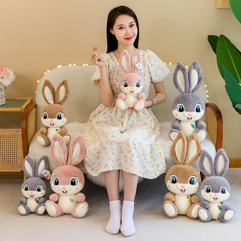 Sweet Bunny plush toys in gray, brown, and pink displayed in multiple sizes, showcasing available color options and size variations in a cozy home decor setting