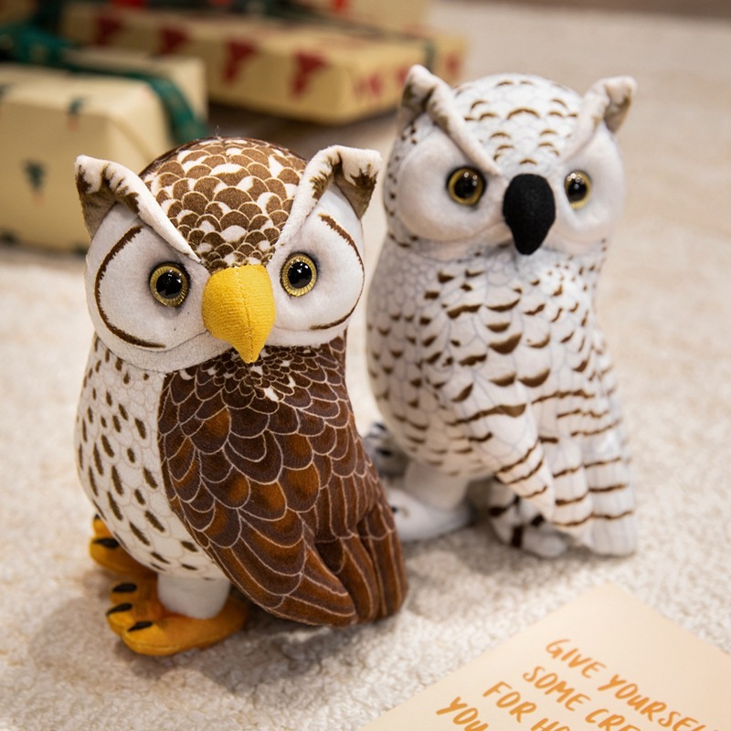 Brown and white owl stuffed animal plush toys with detailed feather prints, soft fabric, and lifelike owl features, displayed together in a warm indoor setting
