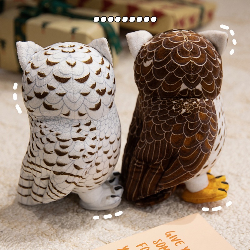 Back view of brown and white owl plush toys showcasing detailed feather pattern printing, wing design, and realistic craftsmanship from every angle
