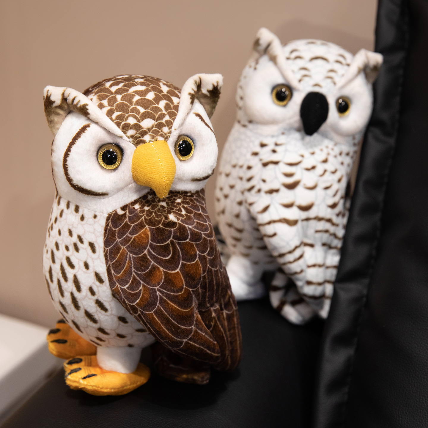 Realistic owl plush toys in brown and white color options, showcasing detailed feather prints and soft plush fabric, perfect for shelves, desks, and cozy home decor