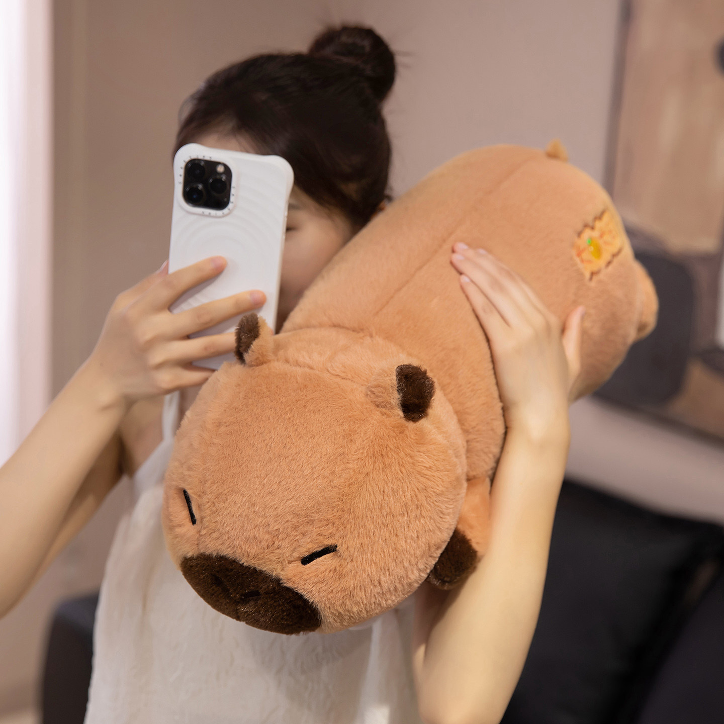 Soft Lucky Capybara plush pillow with a long cuddly body design, ideal for relaxing, hugging, and adding cozy charm to a bedroom or living space