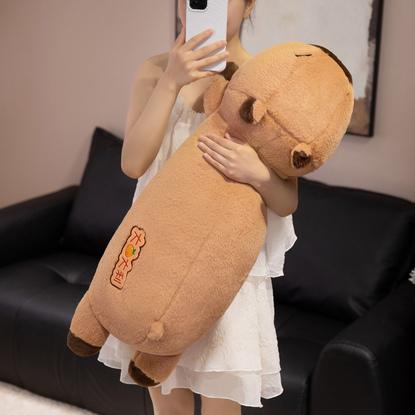 Lucky Capybara plush body pillow with embroidered lucky design, featuring a soft, cuddly shape for hugging, lounging, and cozy comfort