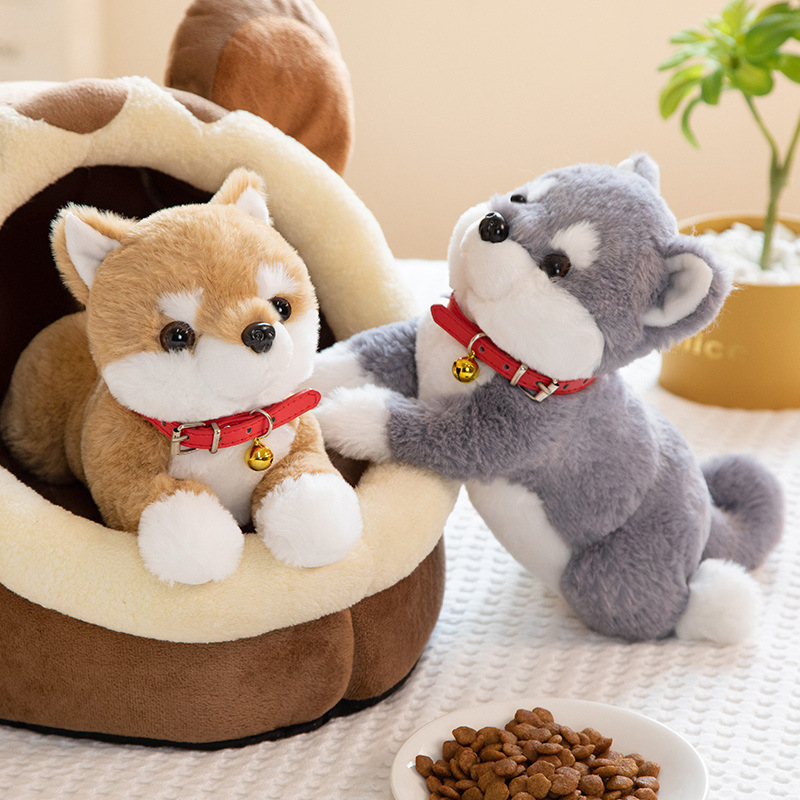Brown and gray Shiba Inu plush toys posed beside a pet bed, showcasing adorable details and playful charm
