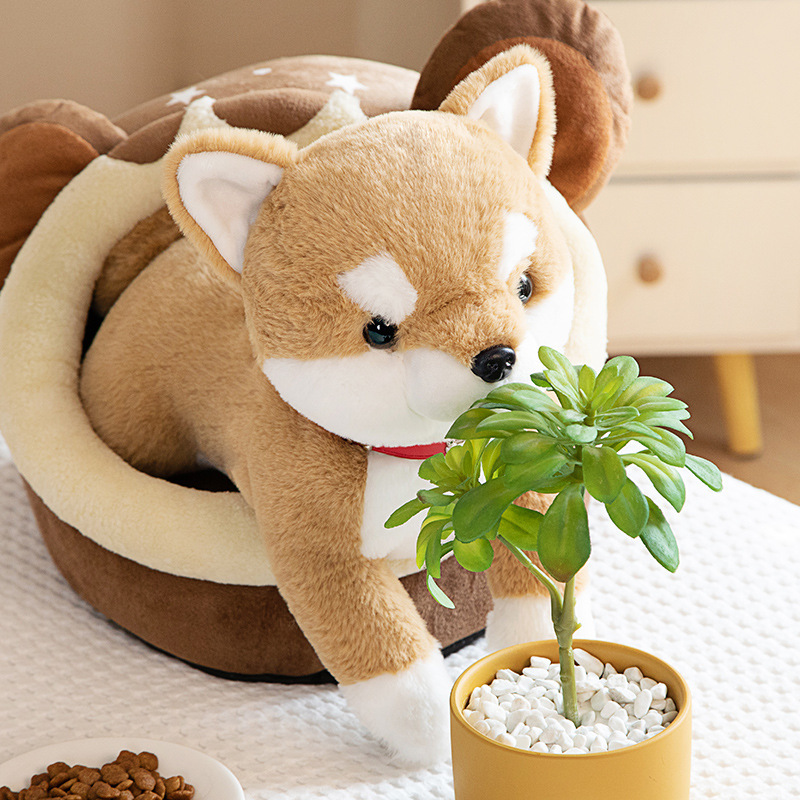 Brown Shiba Inu plush toy beside a pet bed and potted plant, creating a warm and playful display