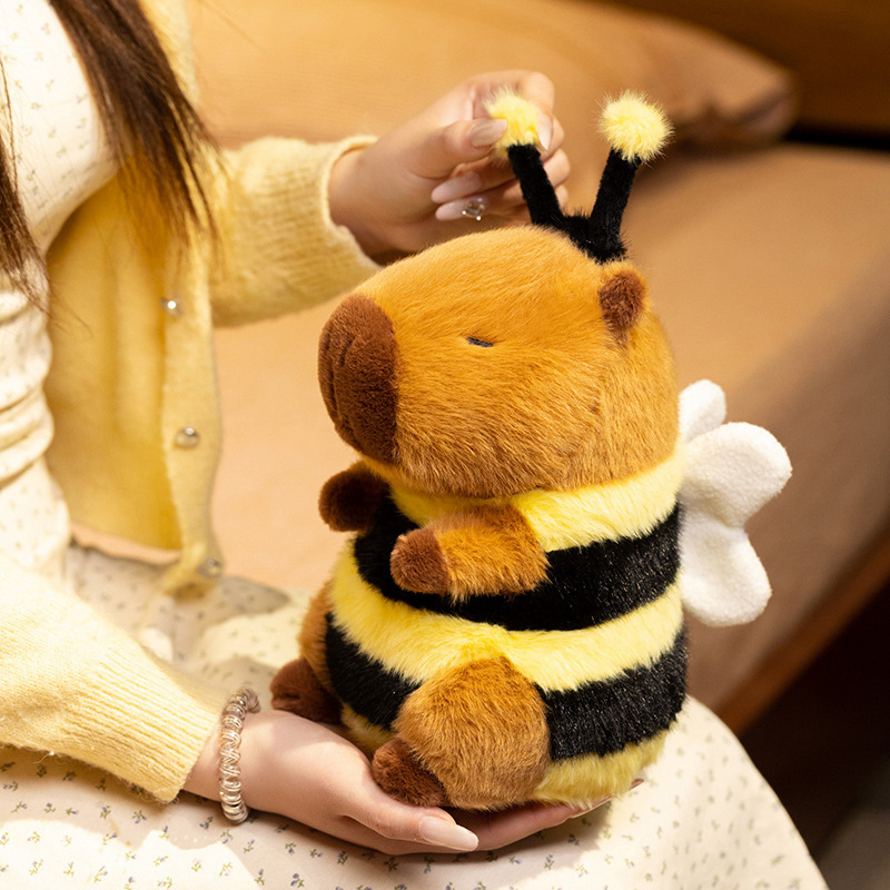 Bee Capybara Plush Toy featuring flexible antennae with fluffy pom-pom tips, soft plush fabric, and a charming bee-inspired design
