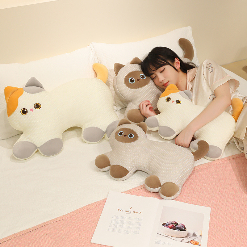 Calico Cat and Siamese Cat cooling plush pillows arranged on a bed, offering soft comfort for hugging, lounging, napping, and cozy bedroom decor