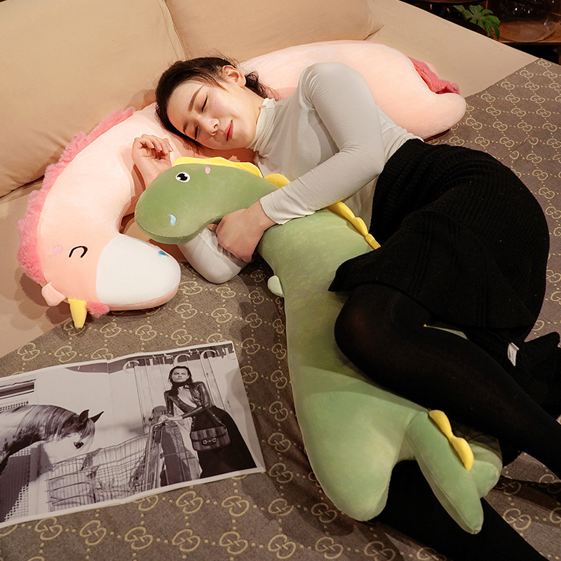 Long dinosaur plush pillows used for cuddling and side sleeping, showcasing their soft body pillow design for comfort and relaxation