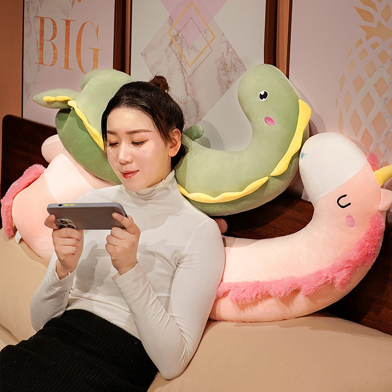 Unicorn and Dinosaur Long Plush Pillows used as soft backrest cushions for lounging, reading, and relaxing