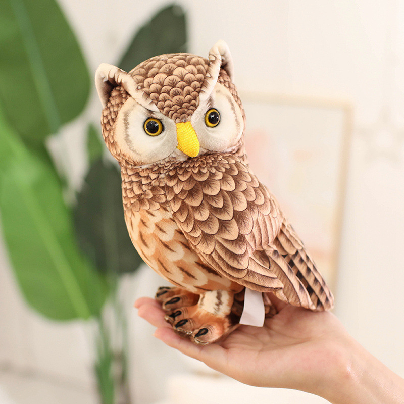 Cute Owl Plush Toy with realistic feather-inspired details and a standing design, shown in hand for size reference
