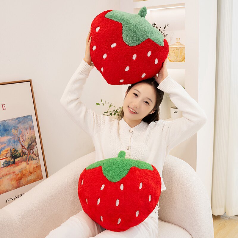 Strawberry plush pillows in terry plush and faux rabbit fur fabrics, perfect for cuddling, decorating, and brightening living spaces with a cheerful touch