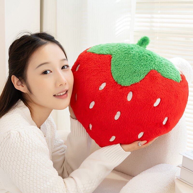 Strawberry plush pillow with soft faux rabbit fur texture, featuring a fluffy fruit-inspired design and embroidered seed details