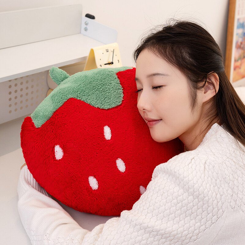 Strawberry plush pillow in terry plush fabric, designed for hugging, lounging, and adding a playful touch to living spaces