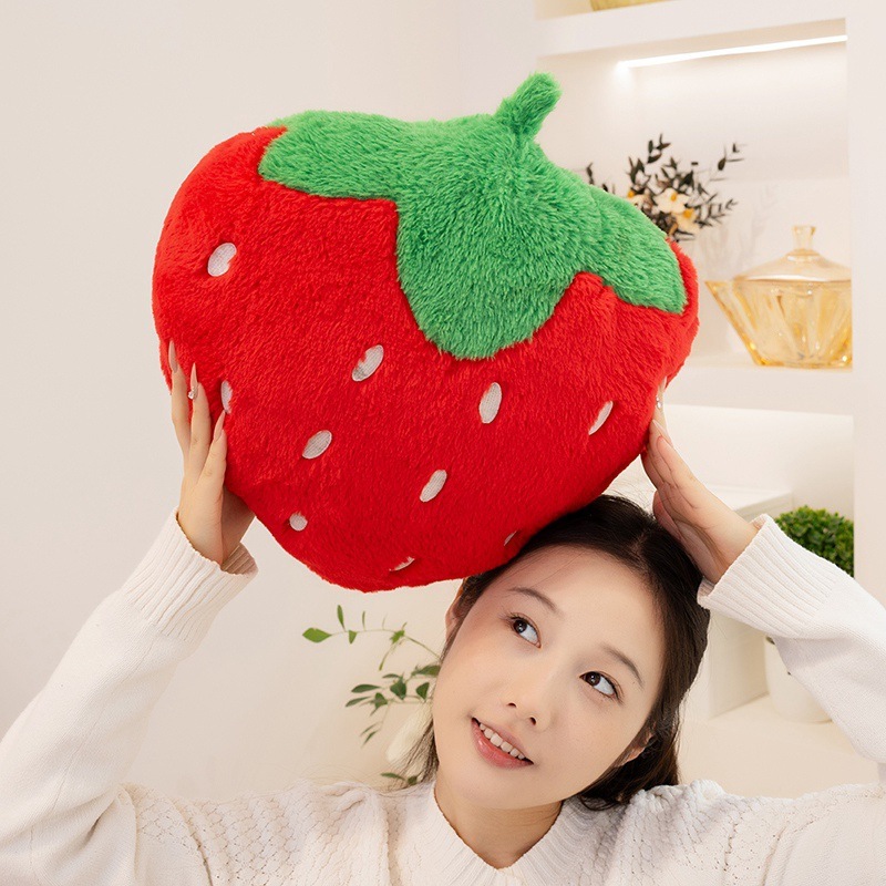 Strawberry plush pillow with soft faux rabbit fur fabric, featuring a bright red fruit-inspired design and cozy decorative appeal for living spaces