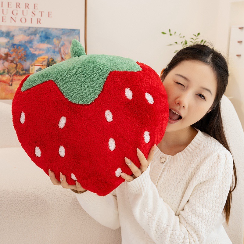 Strawberry plush pillow with terry plush texture, showcasing a cozy fruit-inspired design and soft cushioned shape