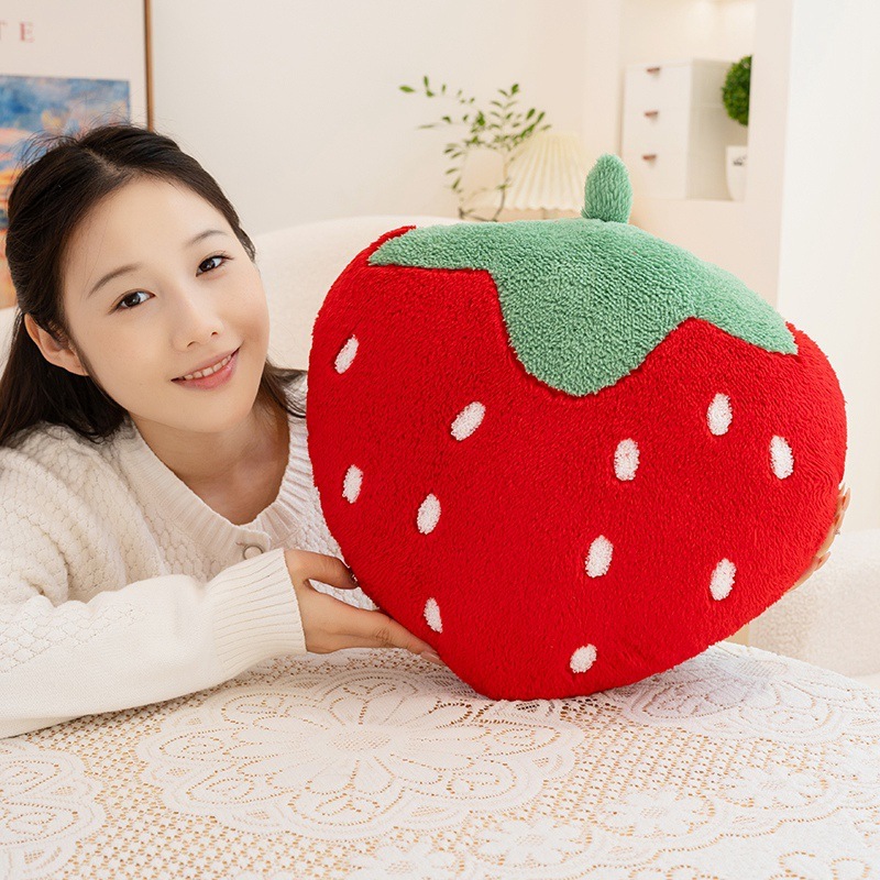 Cute strawberry plush pillow featuring a bright red fruit design, plush surface, and cozy decorative appeal for sofas and beds