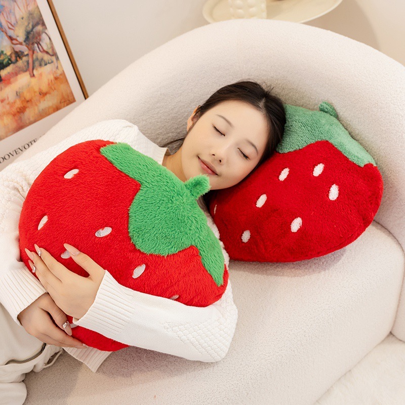 Strawberry plush pillows in terry plush and faux rabbit fur fabrics, designed for cuddling, relaxing, and adding cozy fruit-inspired charm to living spaces