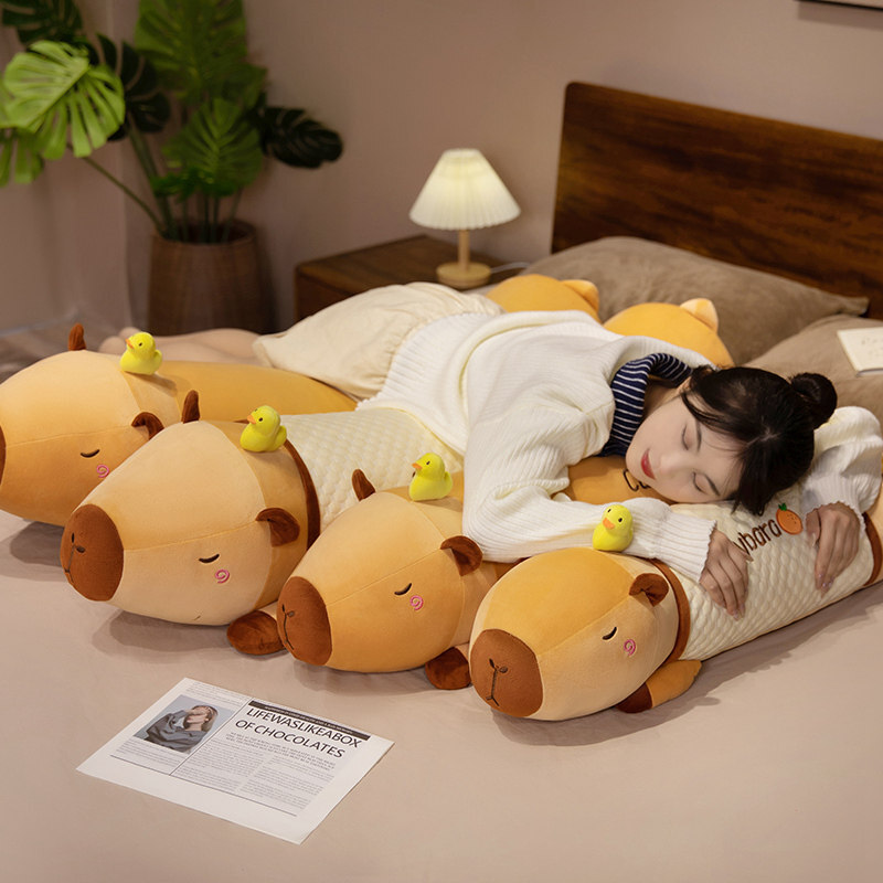 Cute Capybara Long Plush Pillows in plush and cooling fabric styles, arranged on a bed to showcase different sizes and cozy sleep support