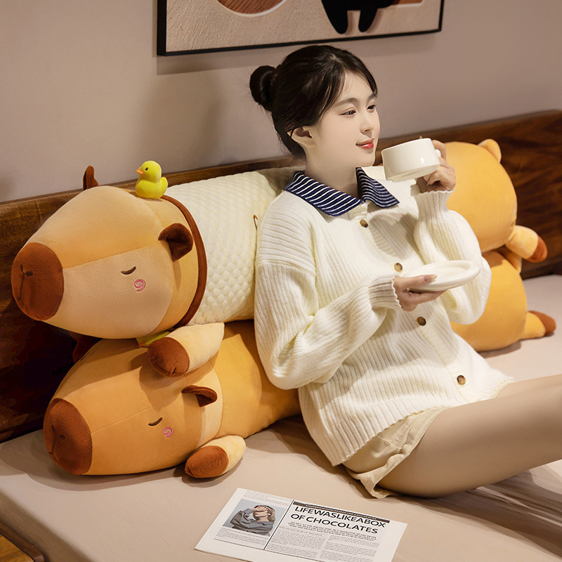 Cute Capybara Long Plush Pillows in plush and cooling fabric styles, creating a cozy lounging and relaxation setup in a bedroom