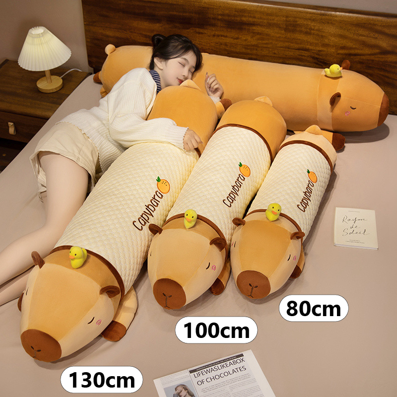 Capybara long plush pillows in 80 cm, 100 cm, and 130 cm sizes, showcasing plush and cooling fabric variants for hugging, sleeping, lounging, and bedroom comfort