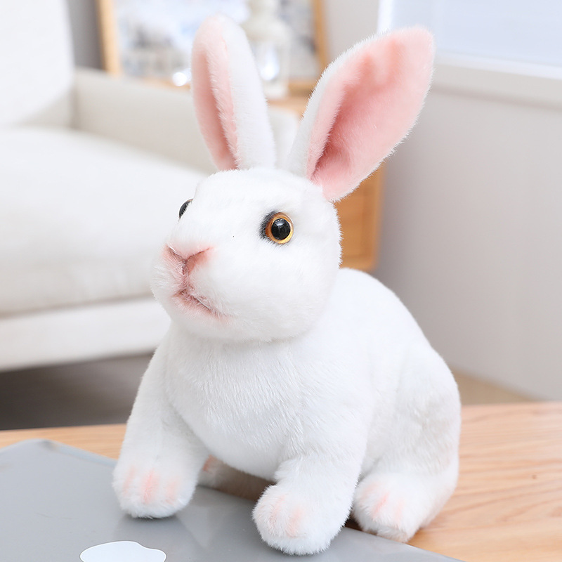 White Realistic Rabbit Plush Toy in crouching style with lifelike fur texture and expressive eyes