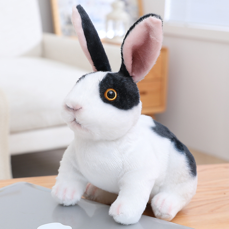 Black White Realistic Rabbit Plush Toy in crouching style with realistic fur patterns and lifelike details