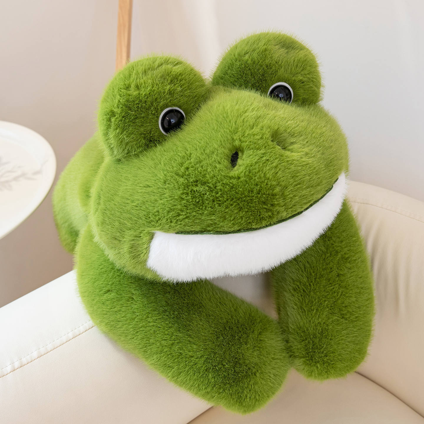 Cute Frog Plush Toy displayed in a cozy living space, featuring a soft body and playful frog-inspired design