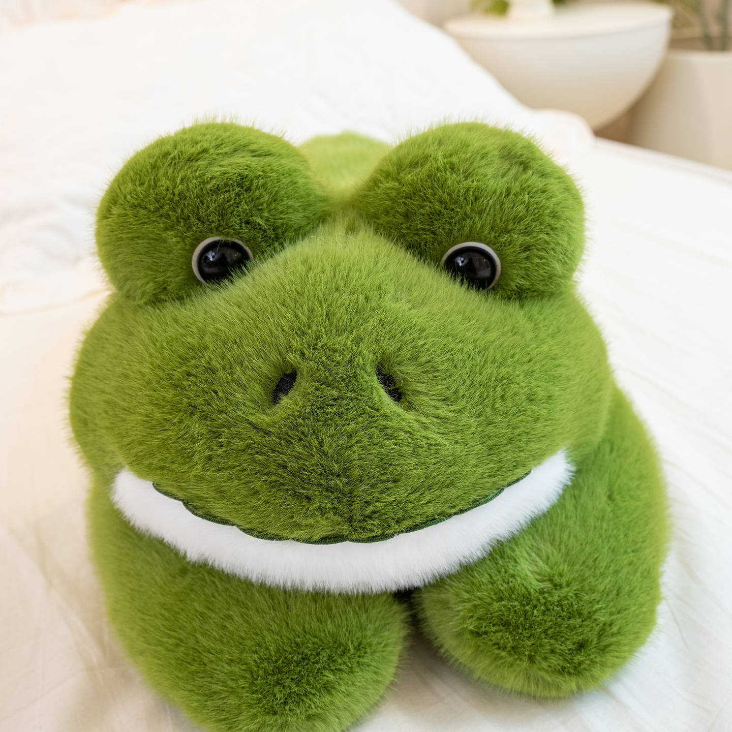 Close-up of a Cute Frog Plush Toy featuring expressive eyes, a cheerful smile, and ultra-soft plush fabric