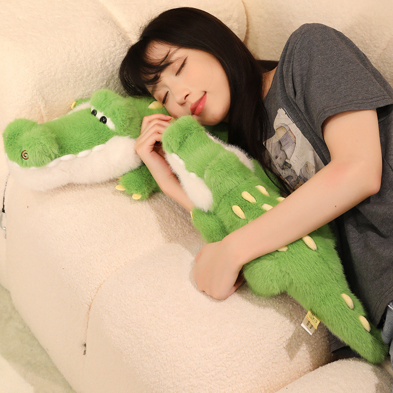 Cute Crocodile Plush Toy with a soft fluffy body, designed for cuddling and relaxing on a cozy sofa