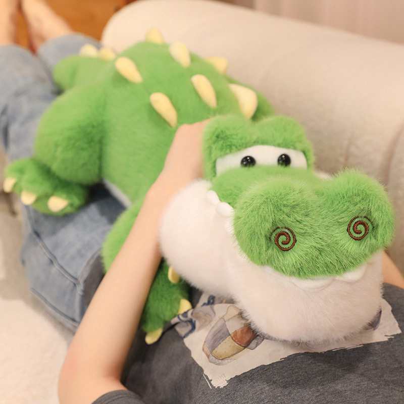 Cute Crocodile Plush Toy resting on a sofa, featuring a fluffy texture and cuddly design for cozy lounging and comfort