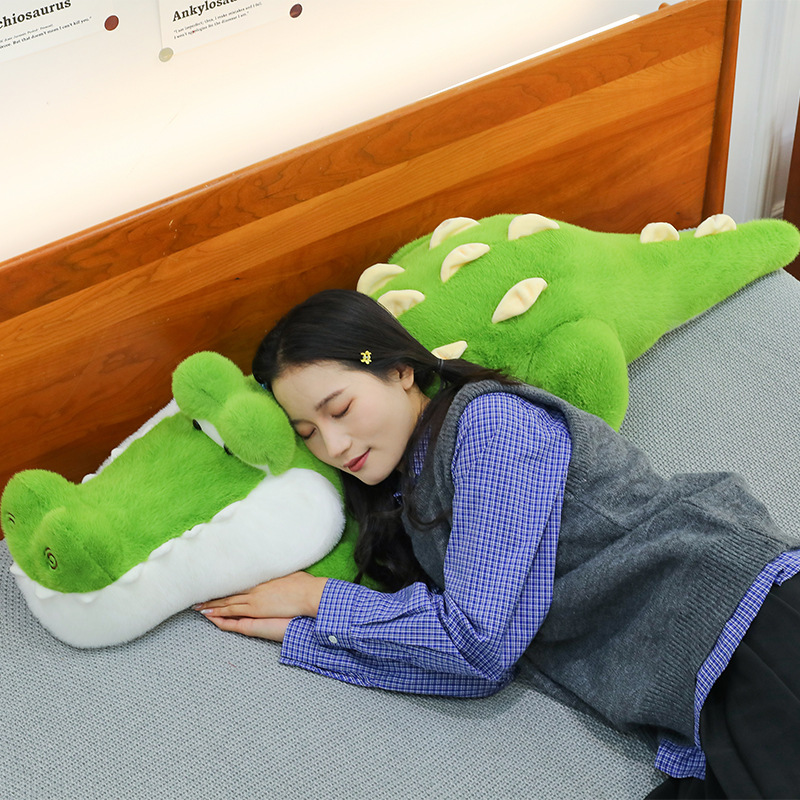 Cute Crocodile Plush Pillow used as a cozy pillow for resting, with a soft plush surface and supportive long body design