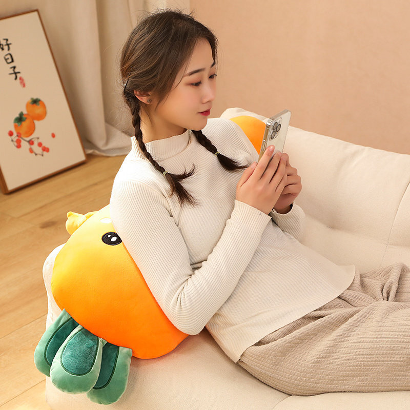 Yellow Carrot Plush Pillow providing comfortable back support while relaxing on a sofa