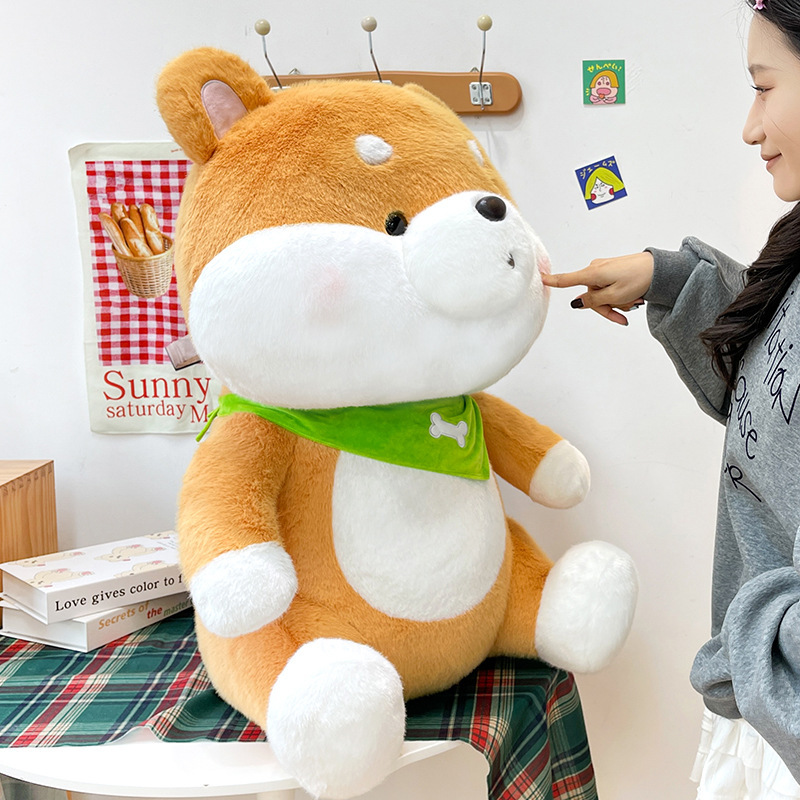 Side view of a Shiba Inu plush toy with a green bandana highlighting its soft contours and cuddly shape
