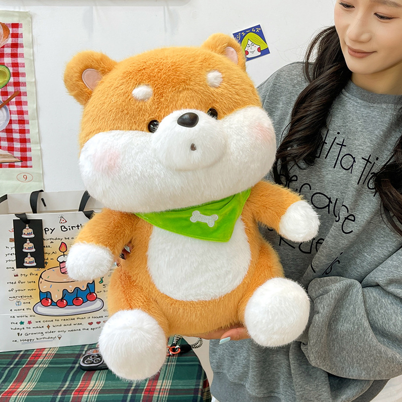 Shiba Inu plush toy with a green bandana showcasing fluffy cheeks, soft texture, and embroidered facial details
