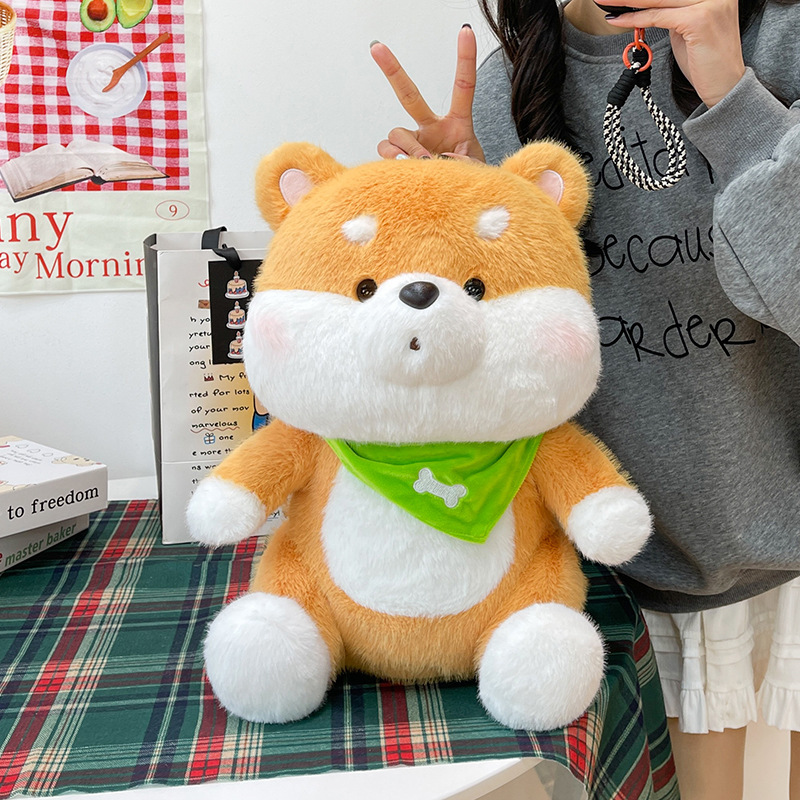 Shiba Inu plush toy with a green bandana showcasing its fluffy texture, soft filling, and cuddly sitting shape