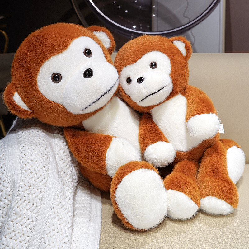 Cute Monkey Plush Toys resting together on a sofa, featuring soft plush fabric, swinging limbs, and a cozy companion design