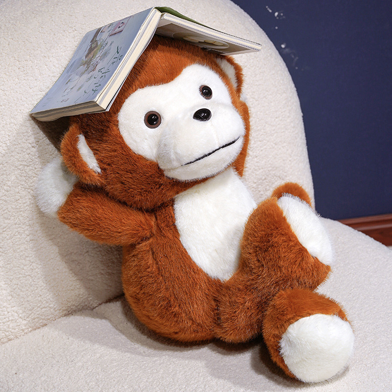 Cute Monkey Plush Toy sitting in a cozy chair, featuring soft plush fabric and a charming monkey design for relaxation and decor