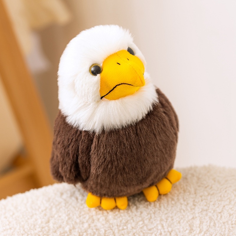 Bald Eagle Plush Toy with fluffy white feathers, a bright yellow beak, and soft plush texture, displayed in a cozy home setting