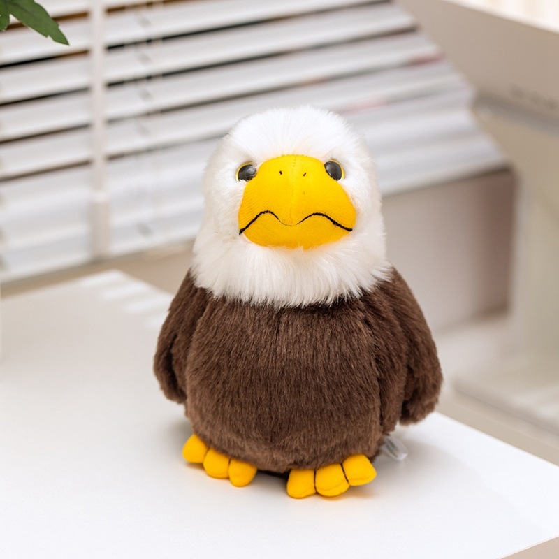 Front view of the Bald Eagle Plush Toy featuring fluffy white feathers, a bright yellow beak, soft plush fabric, and a compact wildlife-inspired design