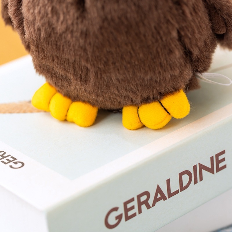 Close-up of the Bald Eagle Plush Toy showing detailed yellow feet, soft plush fabric, and carefully crafted wildlife-inspired features