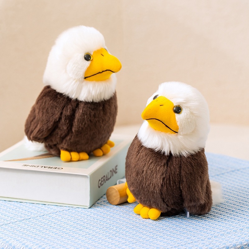 Bald Eagle Plush Toys displayed on books and tabletop decor, featuring soft plush fabric, fluffy white heads, and nature-inspired styling