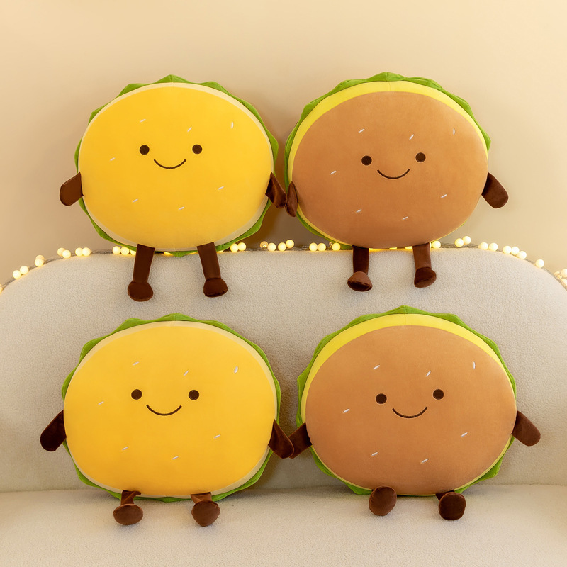 Cute burger plush pillows in yellow and brown color options displayed together, featuring smiling faces, soft plush fabric, and cozy food-themed decor for sofas and living spaces