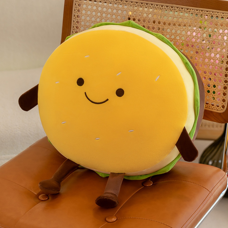 Yellow burger plush pillow with a smiling face, soft plush fabric, layered burger details, and a thick rounded cushion design for cozy home decor