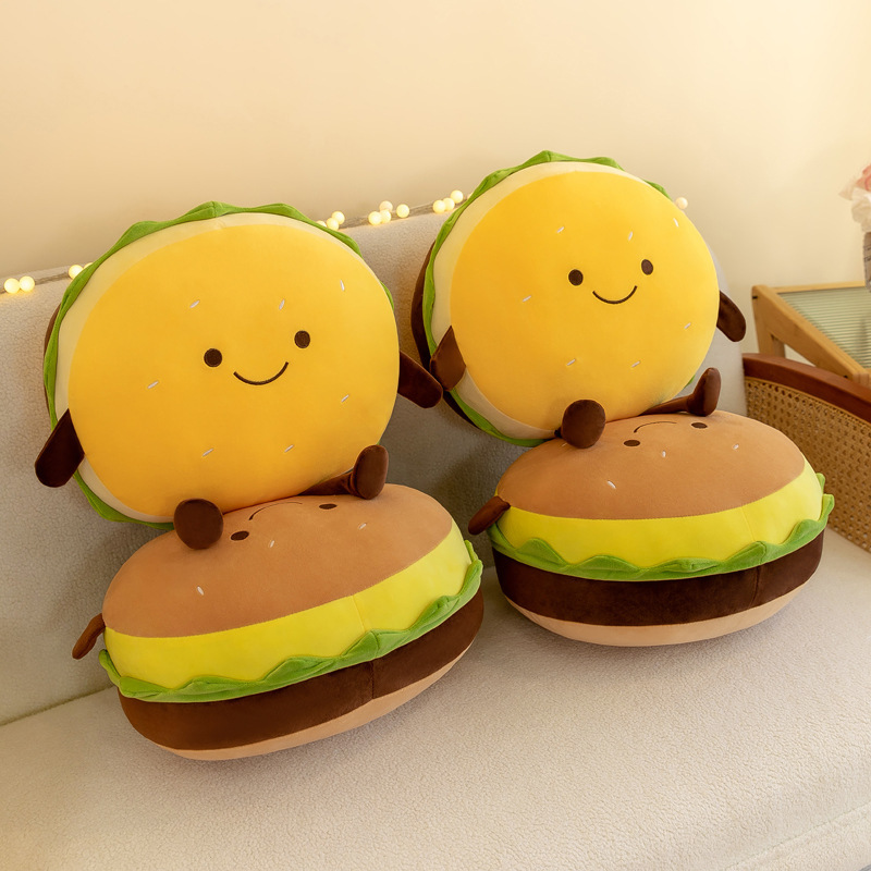 Yellow and brown burger plush pillows displayed together, showcasing smiling faces, layered burger details, soft plush fabric, and thick rounded cushion design