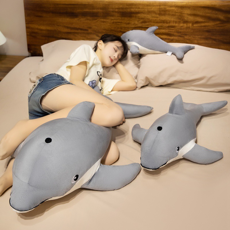 Cute Dolphin Plush Pillow creating a cozy sleeping space for bedtime comfort and relaxation